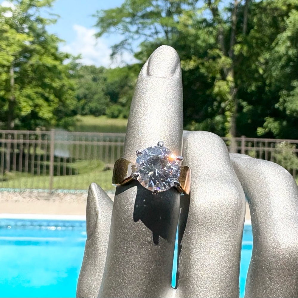 Elegant Gold Tone Ring with Clear Round Stone